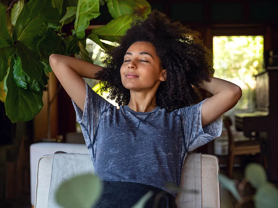 Young woman enjoying fresh indoor air