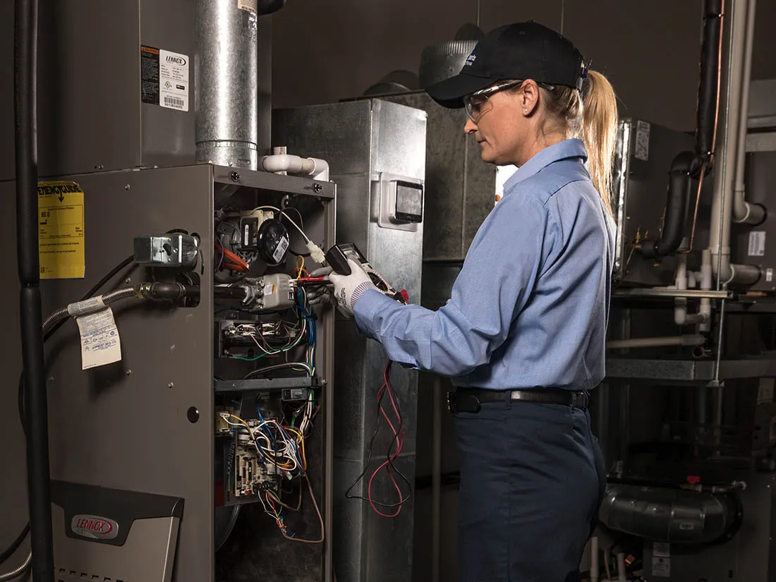 Service Experts technician performing furnace maintenance