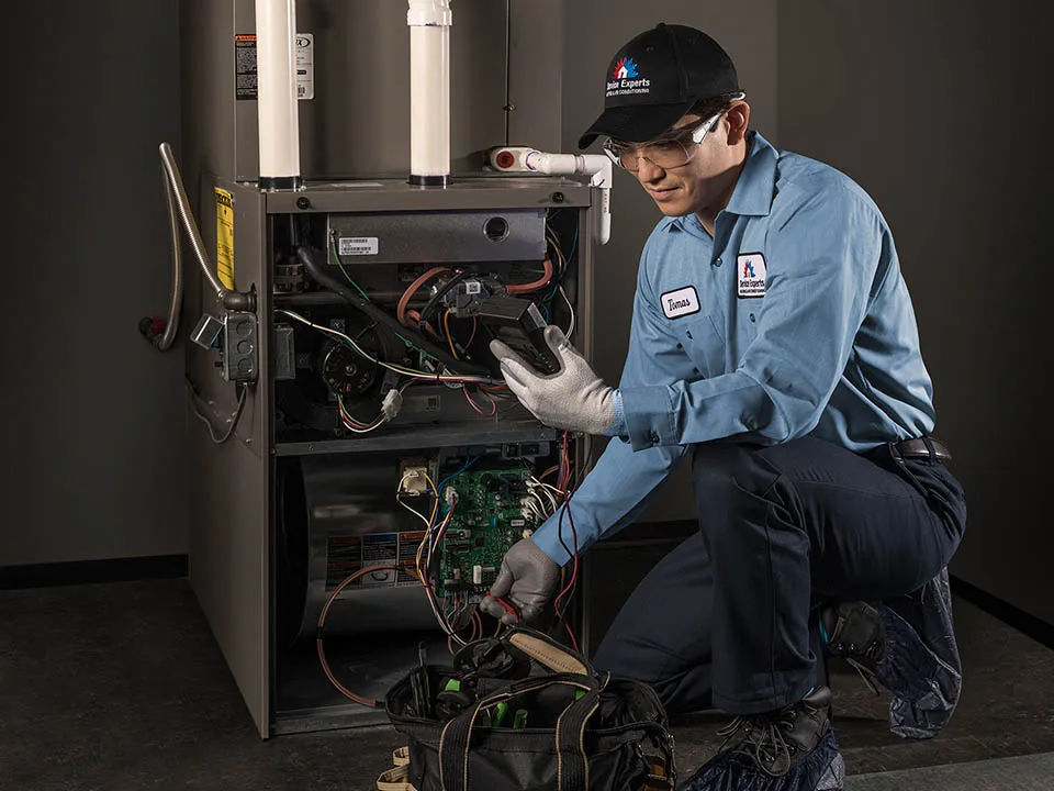 Service Experts technician performing furnace maintenance