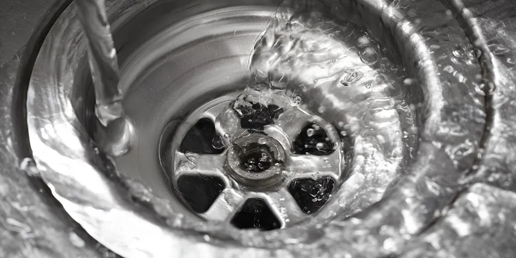 Water running down a sink drain