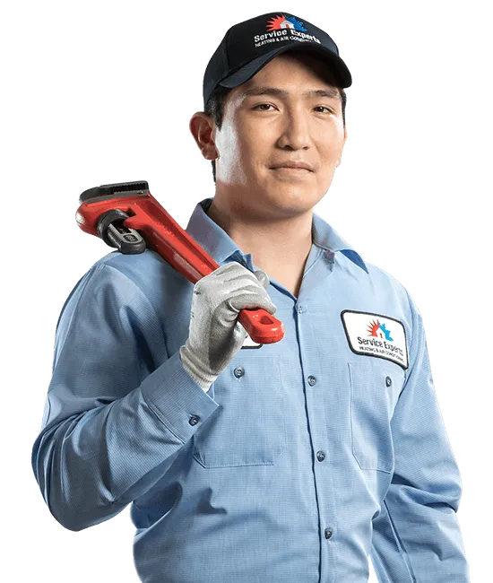 Service Experts plumber holding a wrench