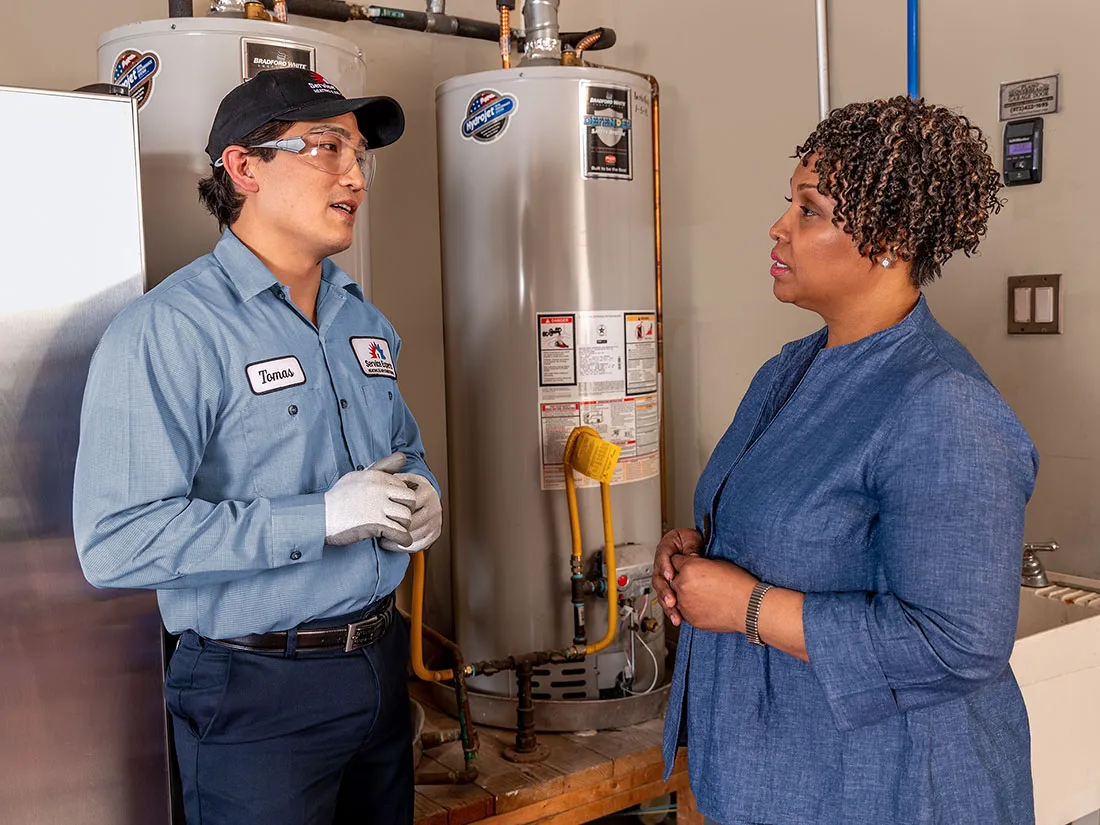 Home owner speaking with Service Experts HVAC technician